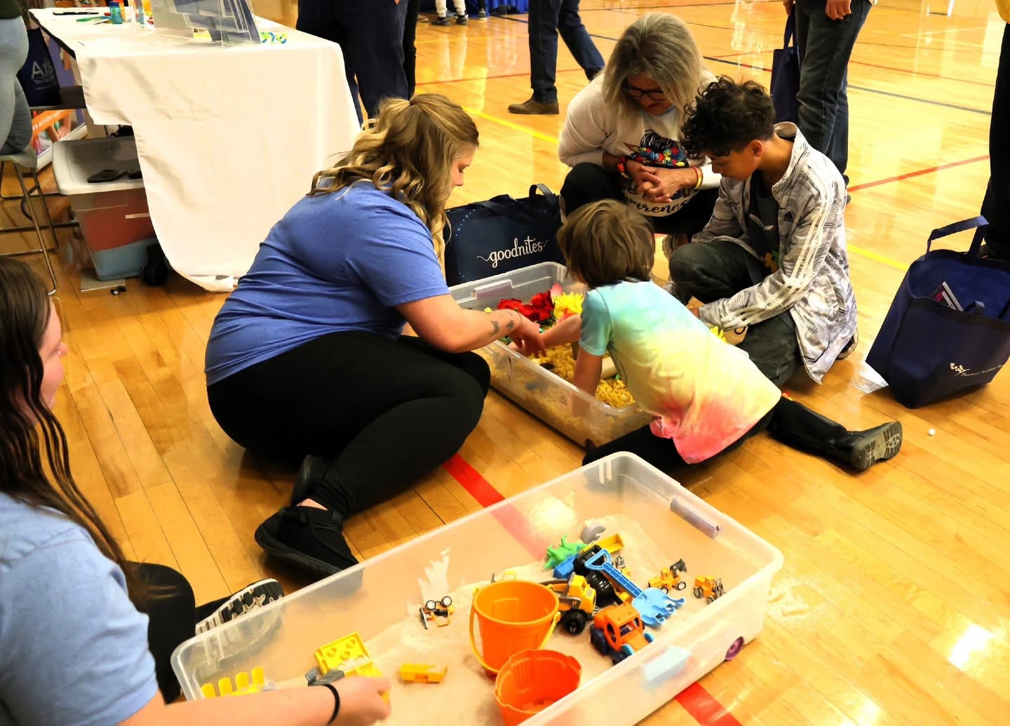 Therapist supporting a child during a play activity